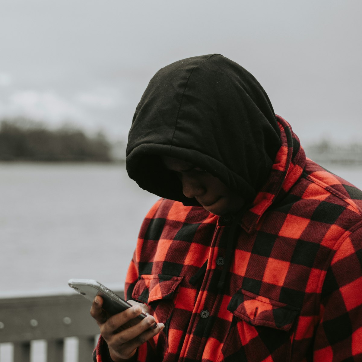 Person checking Crystal Clear App on their phone